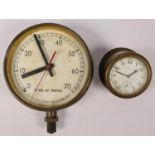 A pressure gauge, marked 'FT.HD of Water' and an unmarked small clock with copper base