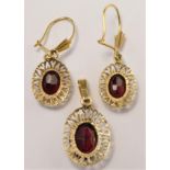 A 9ct gold and garnet pendant, together with a matching pair of ear rings, 2.5gm