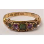 A Victorian 15ct gold five stone gemset ring, Birmingham 1870, possibly tourmaline, garnet, emerald,