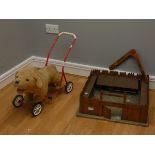 A 1970's Mulholland & Bailie 'Push Along' child's walker, together with a children's wooden fort and