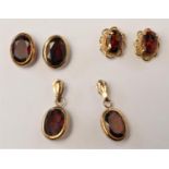 Three pairs of 9ct gold and garnet ear rings, 2.8gm