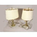 A pair of modern brass table lamps with shades, together with a pair of ceramic table lamps and a