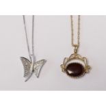 A 9ct white gold and diamond butterfly pendant, chain and a 9ct swivel fob, with onyx and cornelian,