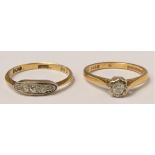 An 18ct gold diamond four stone ring, set with graduated old cut stones, ?, and an 18ct gold