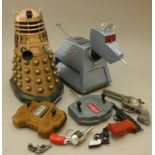 Two Doctor Who battery operated models of K9 and a Darlek together with five 1960's metal 'cap