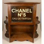 A chemist shop perfume display cabinet, mahogany cased, glazed door with painted lettering