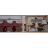 A pair of ceramic table lamps with shades, together with four other ceramic table lamps and