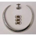 A Mexican silver hammered collar, stamped marks, also TR-68, 925, a Scandinavian silver and tigers