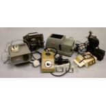 A collection of slide and 8mm projectors, including a Gnome Alphax IV slide projector, along with