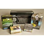 A boxed Sinclair ZX Spectrum to include, joystick, Kempston joystick interface, eight cassettes,