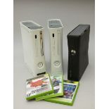 Three Xbox 360 Consoles, two Xbox 360 'core' with missing hard drive covers, one Xbox 360 'Slim',