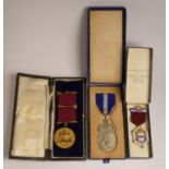 Three silver, silver gilt, silver gilt and enamel Masonic medals, cased, 98gm