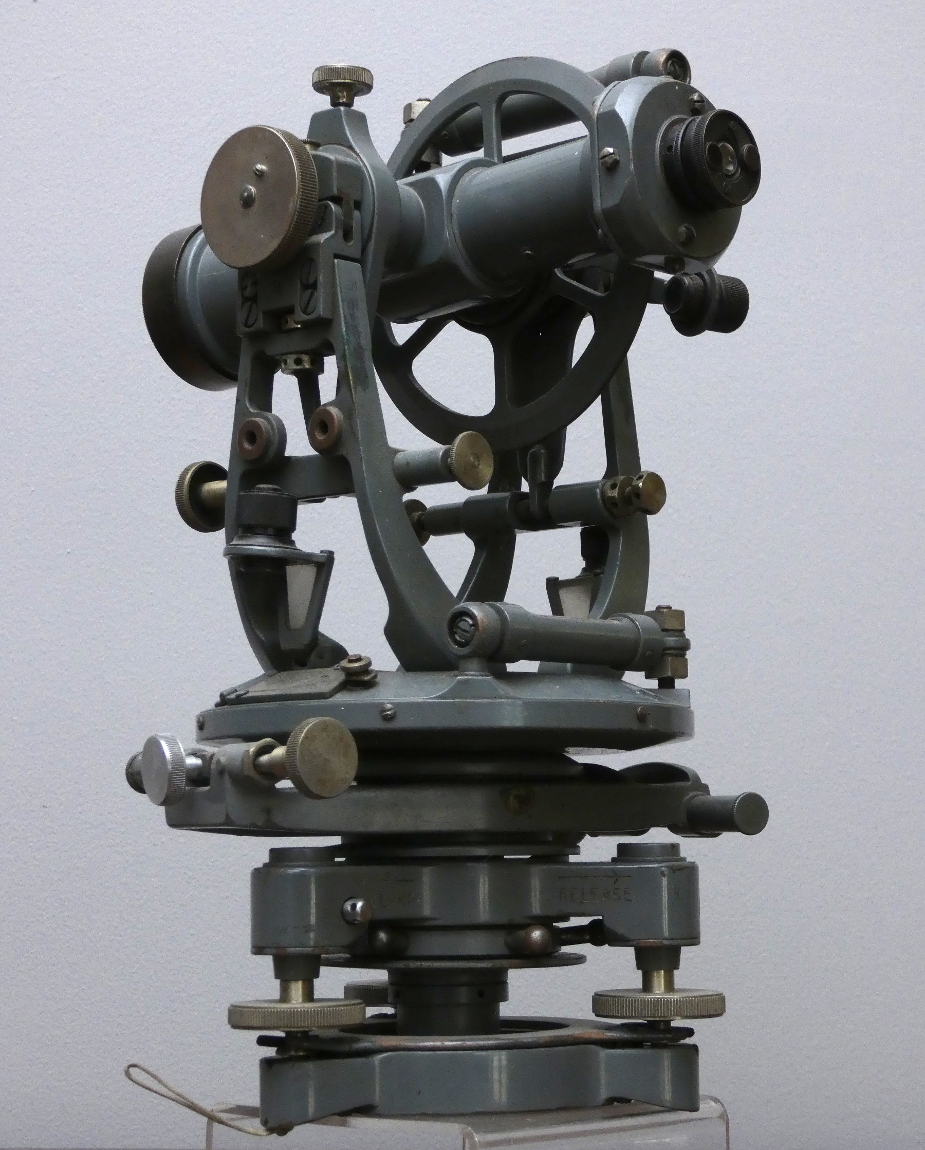 An engineers/surveyors transit theodolite, painted grey, 30 x 20cm.