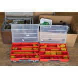 A collection of Meccano green, red, yellow and blue, including flanged plates, wheels, girders,