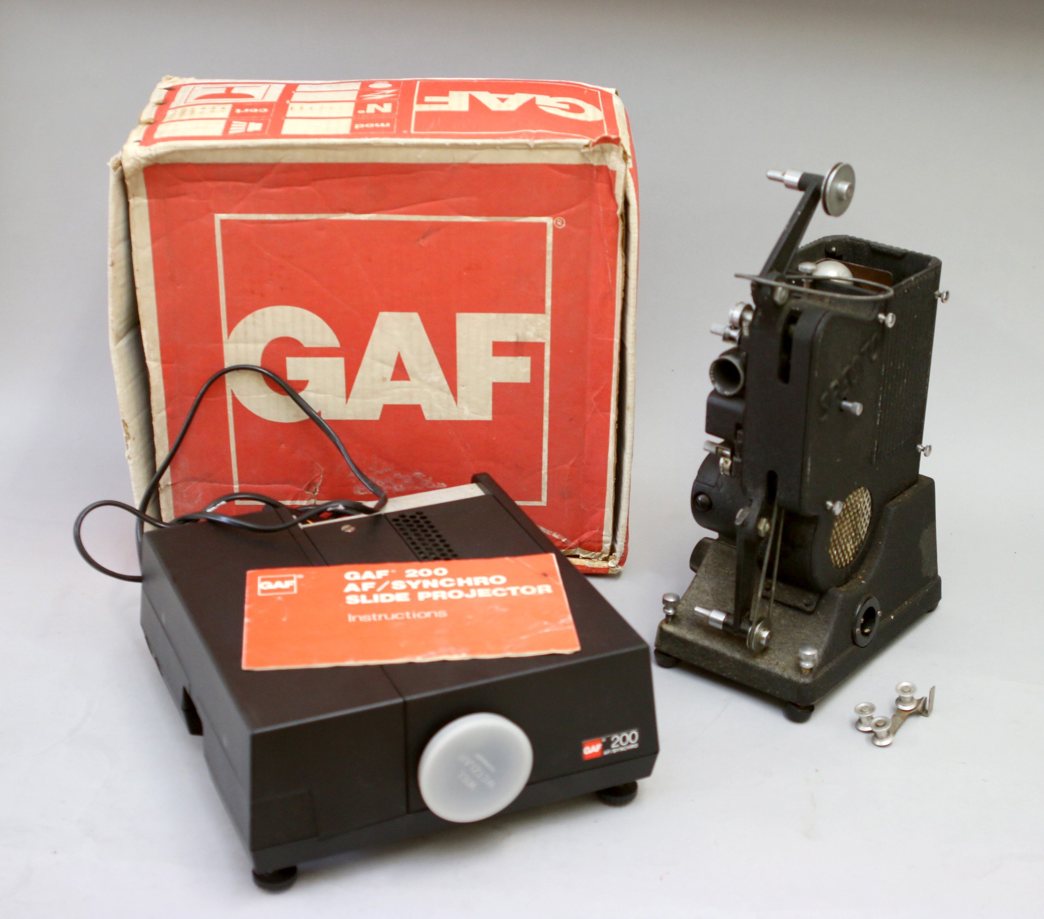 A GAF 200 AF/Synchro Slide projector, with box and manuel, together with a Specto Ltd Type C movie
