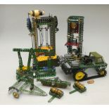 A collection of Meccano display models to include motorised industrial presses, a pump and a