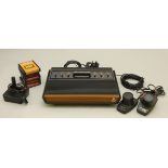 An Atari 2600 (woody) to include power supply unit, a pair of paddle controllers, joystick