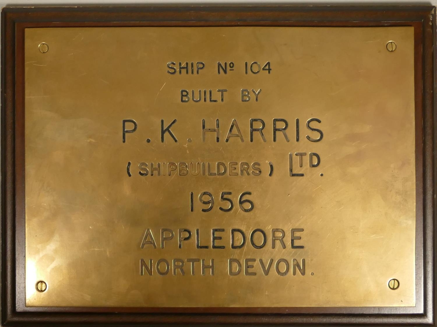 Brian Masterman Collection; Four brass shipping company wall plaques, A.F. Budge, P.K.Harris,