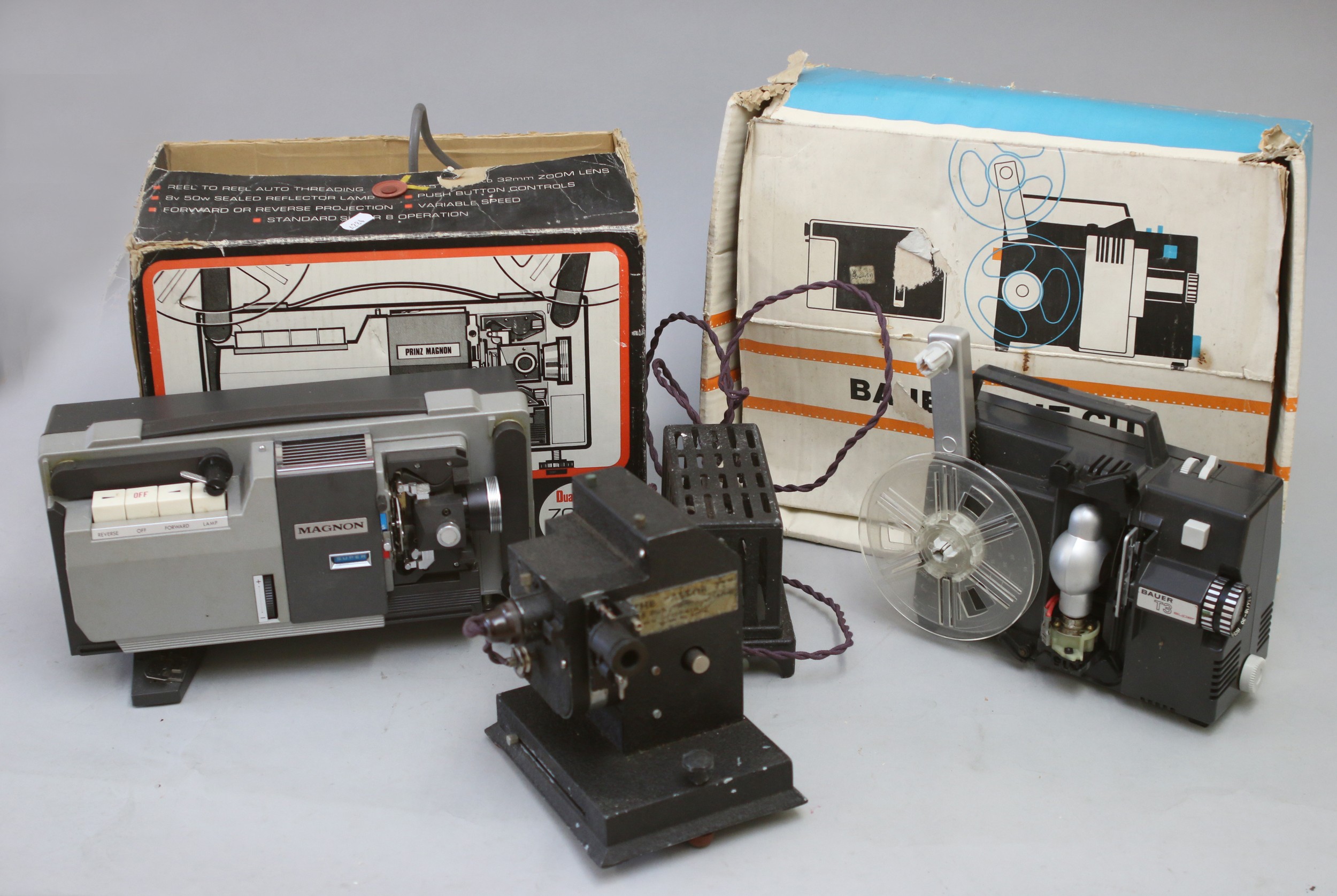 Three 8mm movie projectors, including a Bauer Super T3, with a fitted interior box and