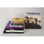 A collection of 11 The Beatles books and a vinyl LP/33 record 'The Beatles Rock 'n' Roll volume 1,