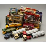 A collection of six Corgi die-cast trucks, together with a collection of boxed die-cast models to