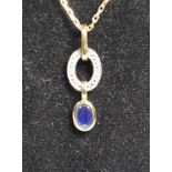 A 9ct gold sapphire and diamond pendant, chain, 3.2gm