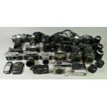 A collection of cameras, mainly of the 35mm format, including brands such as Mirnada,, Minotla and