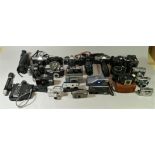 A collection of cameras, mainly of the 35mm format, including brands such as Pentax, Praktica and