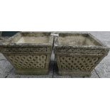 A pair of Cotswold Studios Ltd (Stamped) U19 composite garden planters, with carved decoration,