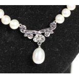 A single row cultured pearl necklace, 5mm diameter, length 45cm