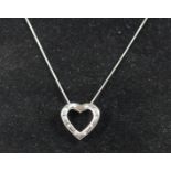 A 9ct white gold and single cut diamond set heart pendant, chain, 4.4gm