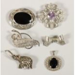 A silver and marcasite elephant brooch, four other silver brooches and a pendant