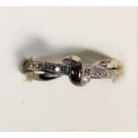 A 9ct white gold and diamond crossover ring, M, 2.2gm