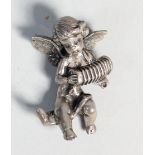 A cast silver model of a winged cherub playing a squeeze box, loop stamped 925, 6cm, 78 gm