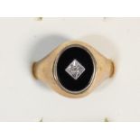 A 9ct rose gold onyx and diamond signet ring, X, 3.4gm