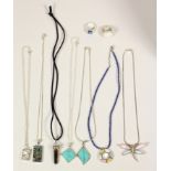 Three silver and mother of pearl pendants, two silver and turquoise pendants, two other pendants and