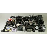 A collection of cameras, mainly of the 35mm format, including brands such as Canon, Minolta and