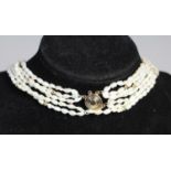 A six row rice pearl necklace with 14K clasp and beads, 62cm