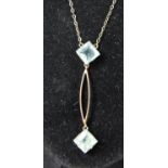 A 9ct rose gold a pale blue paste necklace, 2.5gm, length 43mm, chain 39cm, case