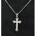 An 18ct white gold and brilliant cut diamond set cross pendant, 27mm overall, 18ct chain, 3.7gm,