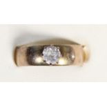 An unmarked gold and white sapphire single stone ring, O 1/2, 4gm