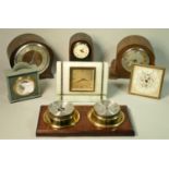 A collection of clocks and wall barometers to include manual wind and quartz examples. (2)