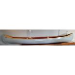 A fibreglass three person Canadian type canoe, with timber edging, 4.5m, by repute from
