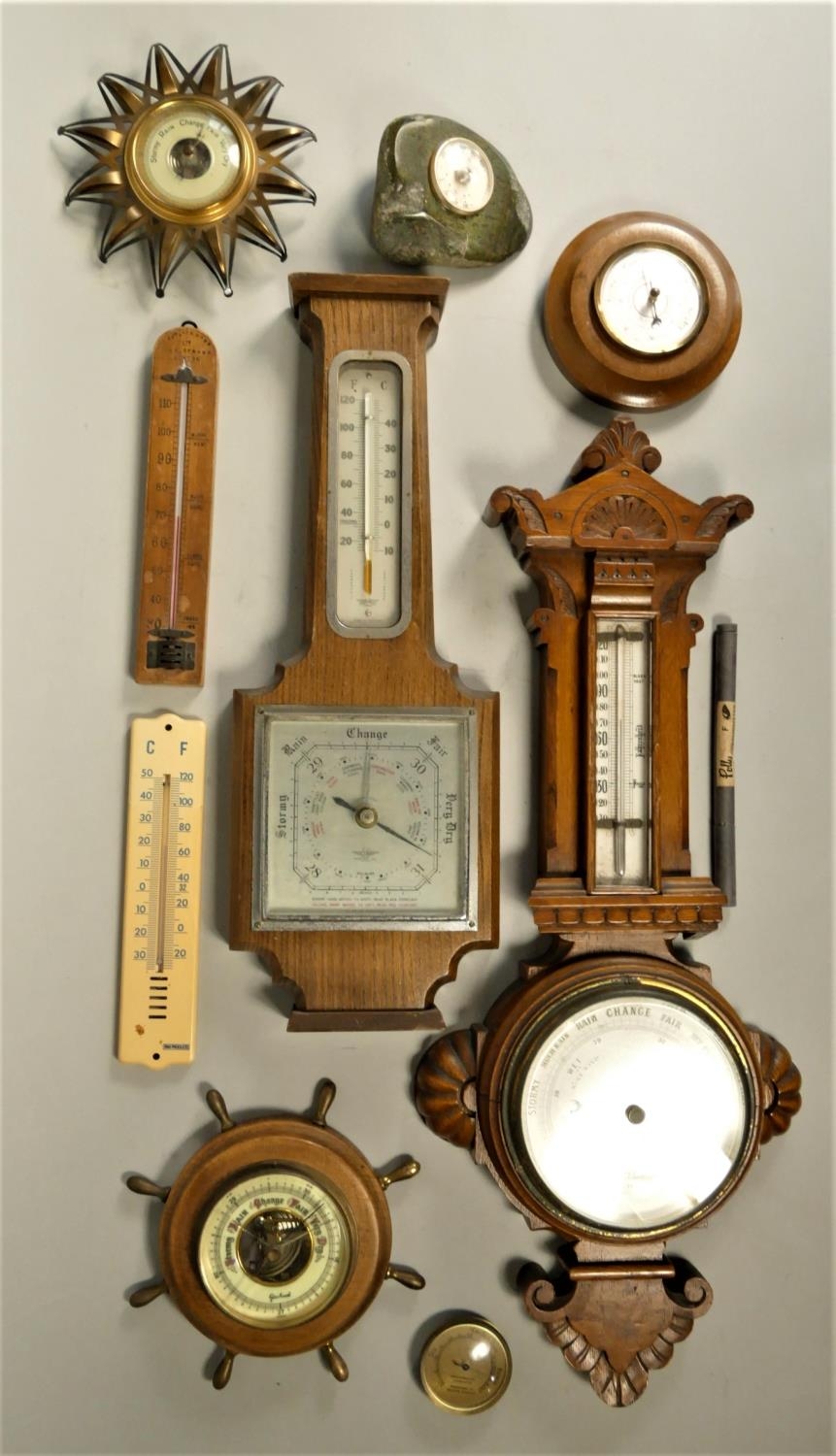 A collection of carriage and anniversary clocks together with a collection of barometers. (4)