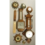 A collection of carriage and anniversary clocks together with a collection of barometers. (4)