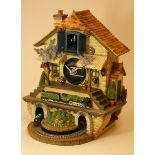 A limited edition Flying Scotsman musical cuckoo clock, made from ceramic and painted resin....