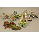 A collection of porcelain model birds, together with a pair