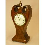 An Art Nouveau shaped mahogany, satinwood and boxwood inlaid mantel clock, together with a