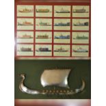 A framed polished steel 3D model of a Norge Viking ship, 104 x 55cm, together with a framed