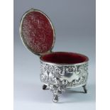 An Edwardian silver trinket box, Birmingham 1904, hinged mirror tableau cover, embossed body